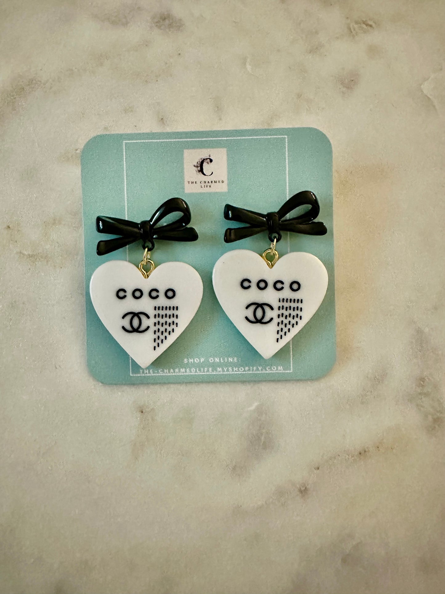 CC white resin heart earrings