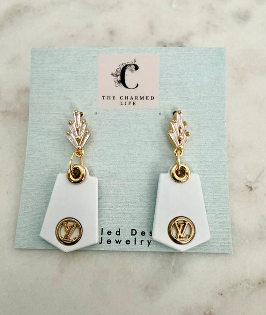 LV gold and white rhinestone earrings