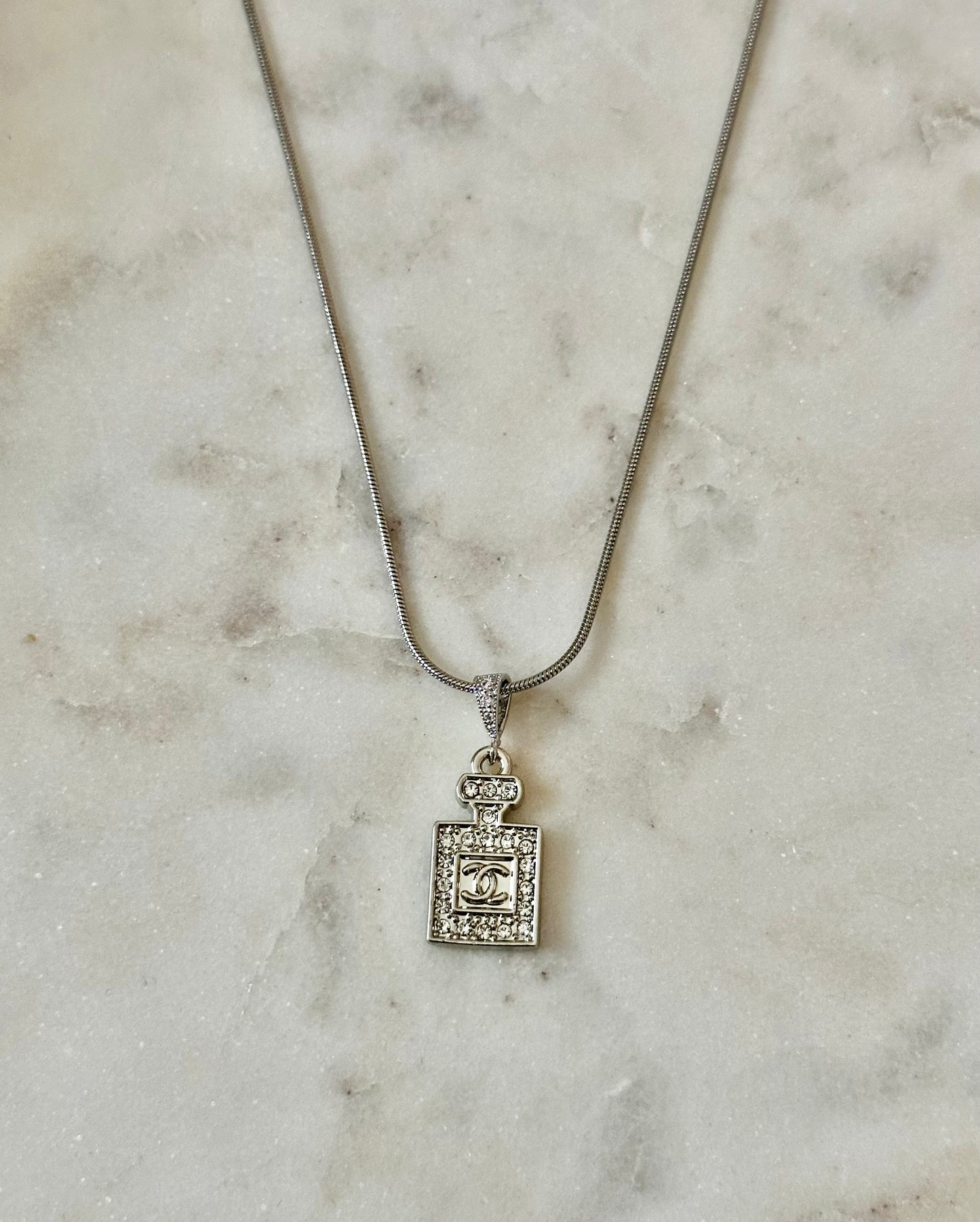CC Perfume bottle silver tone necklace