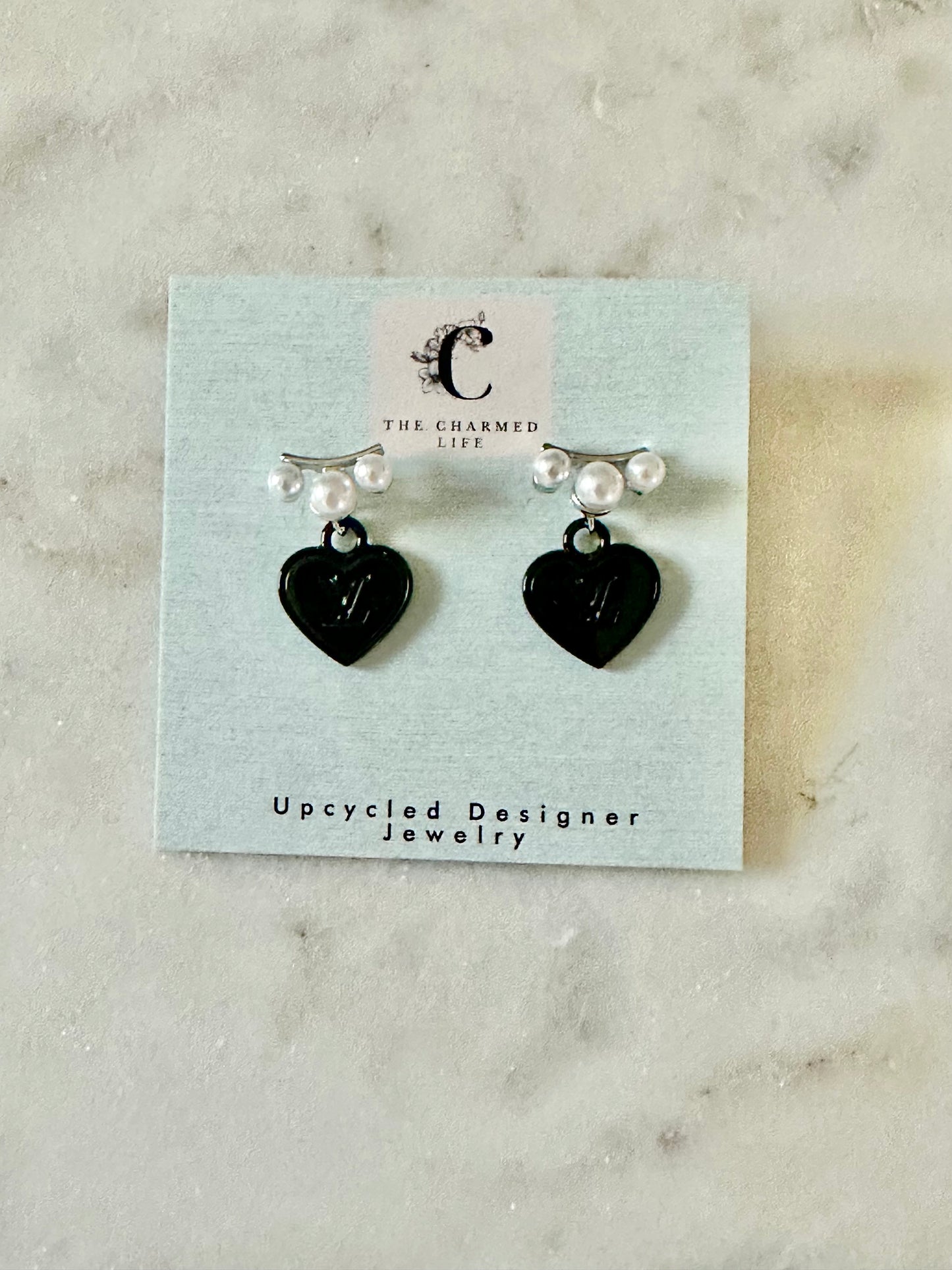LV black heart with faux pearl accent earrings