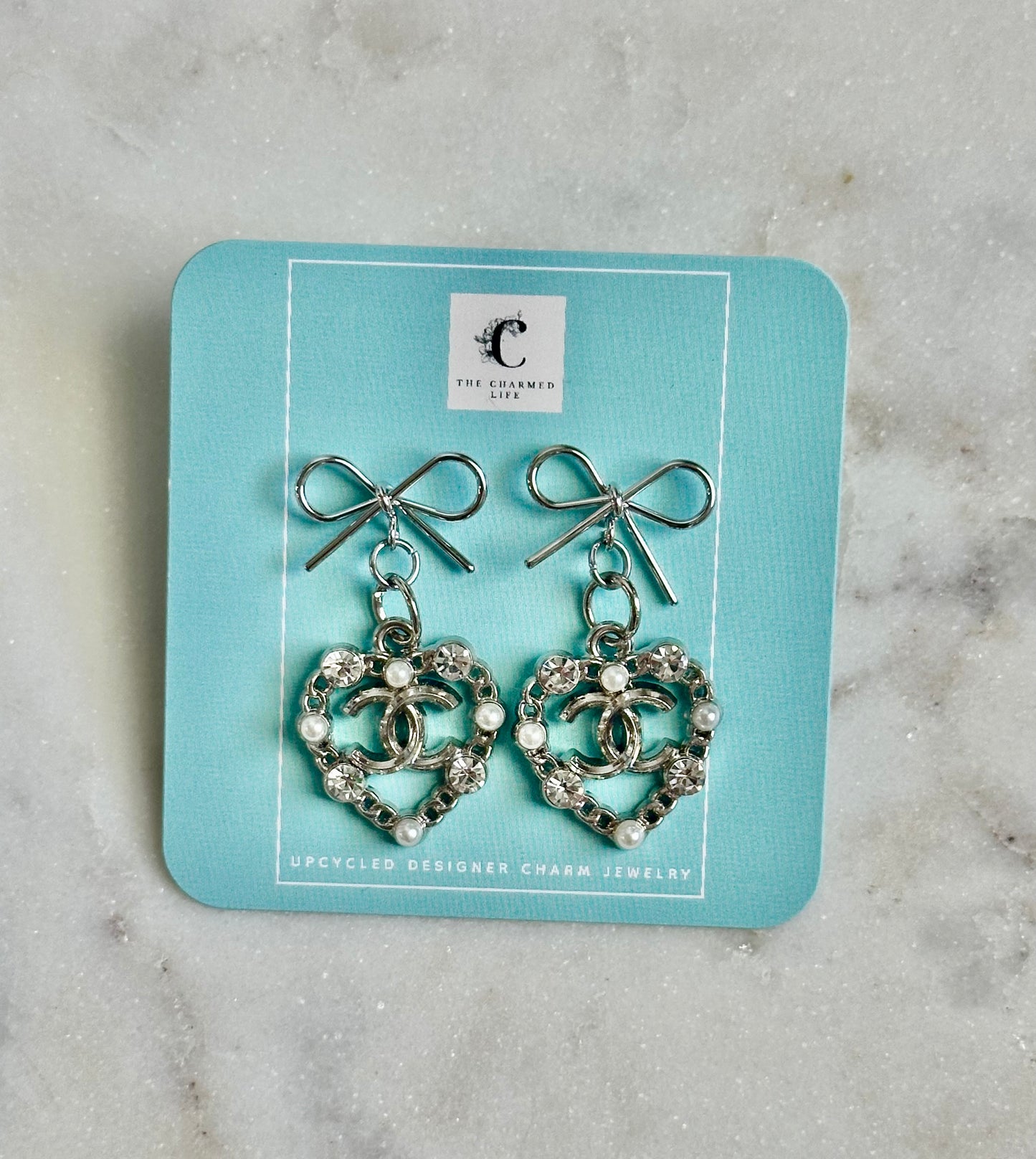 CC heart/pearl bow earrings