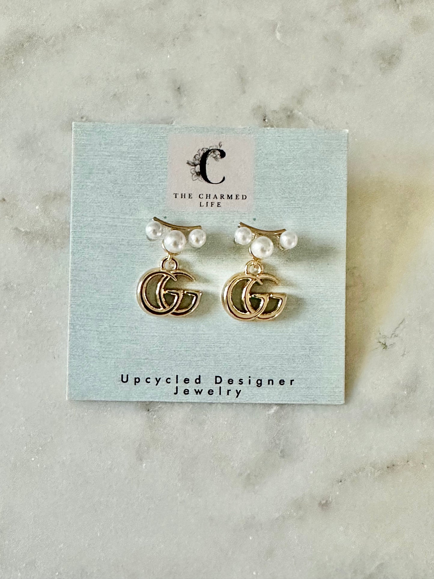 Gucci gold tone with faux pearl accent earrings
