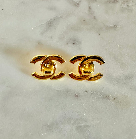 CC gold turn lock button earrings