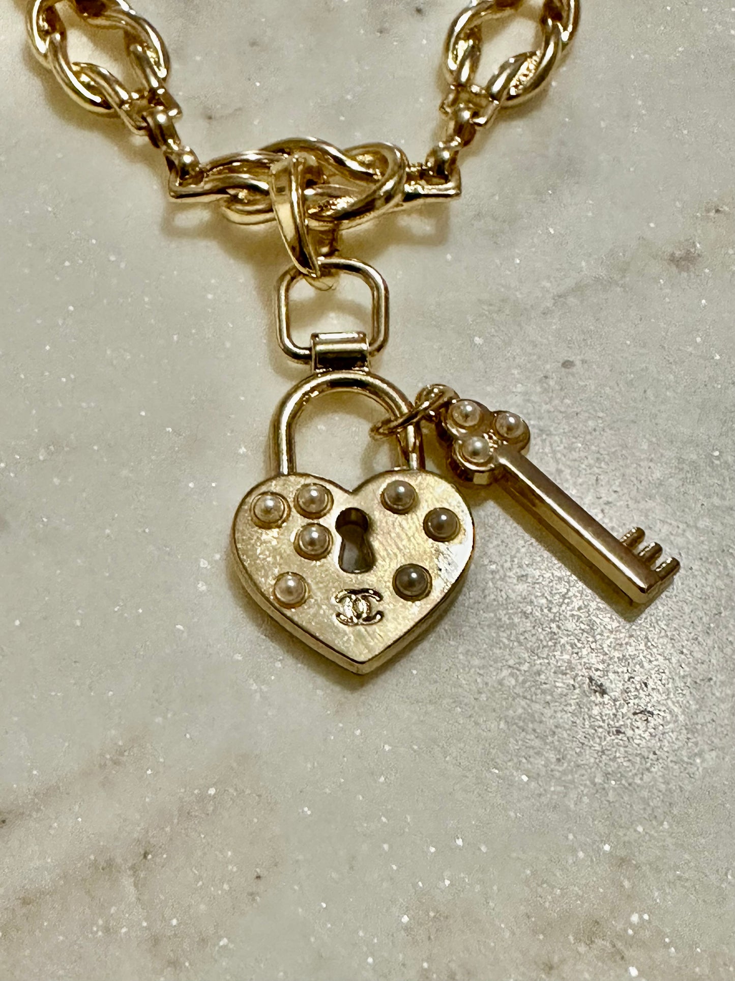 CC lock and key faux pearl necklace