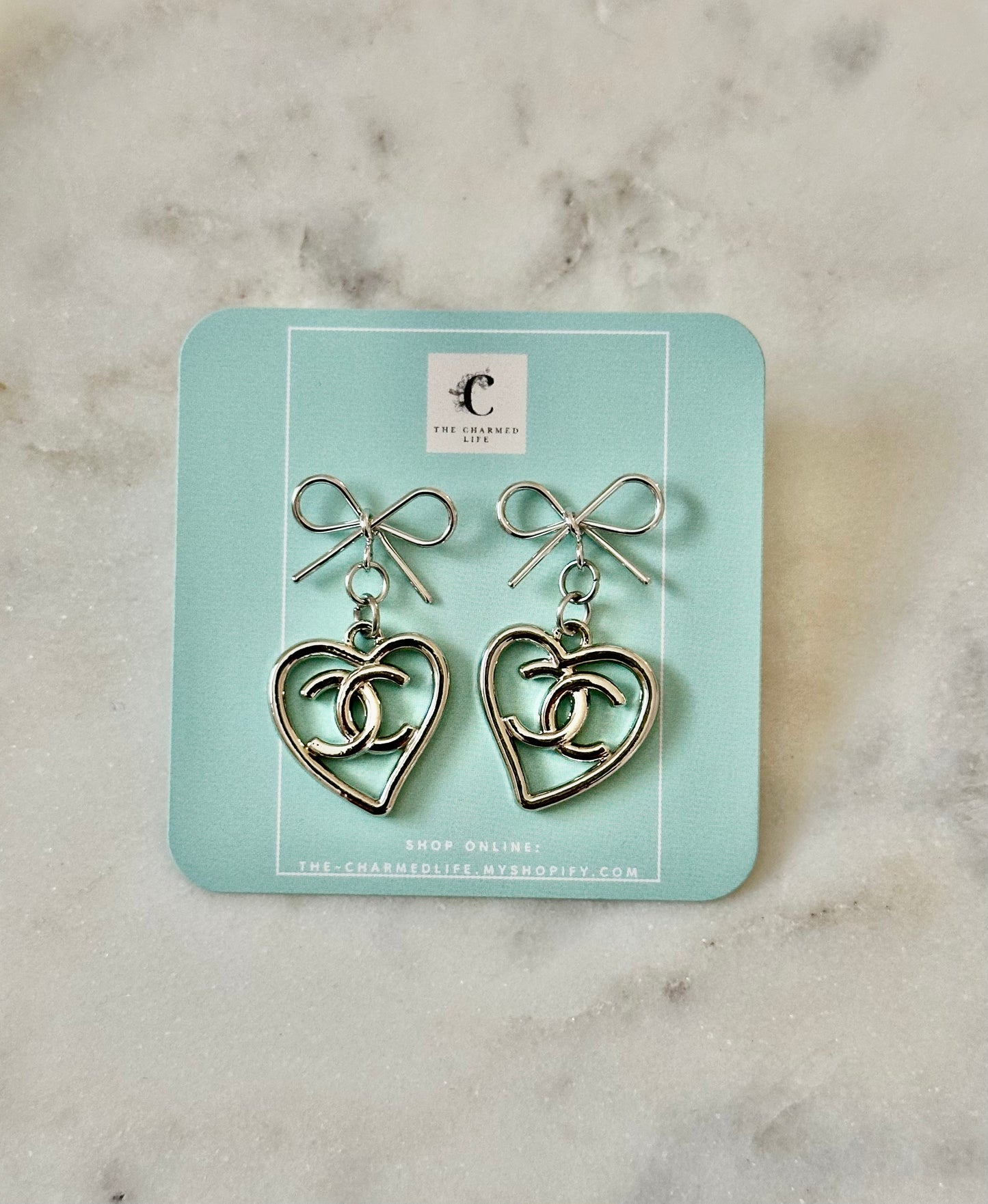 CC heart bow earrings