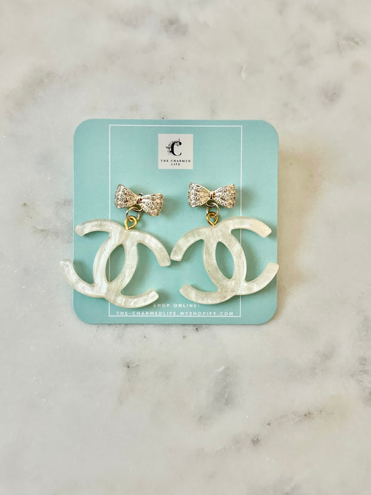 CC cream resin bow earrings