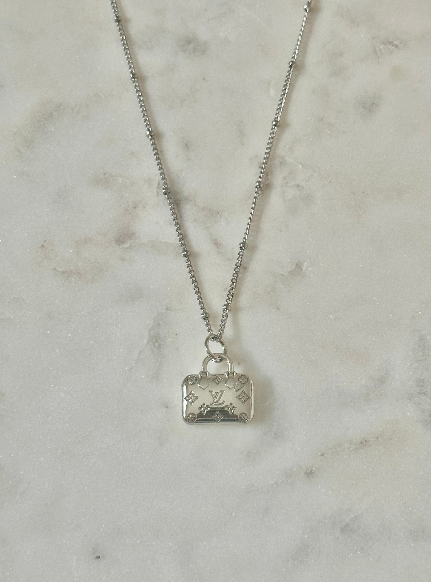 LV purse necklace
