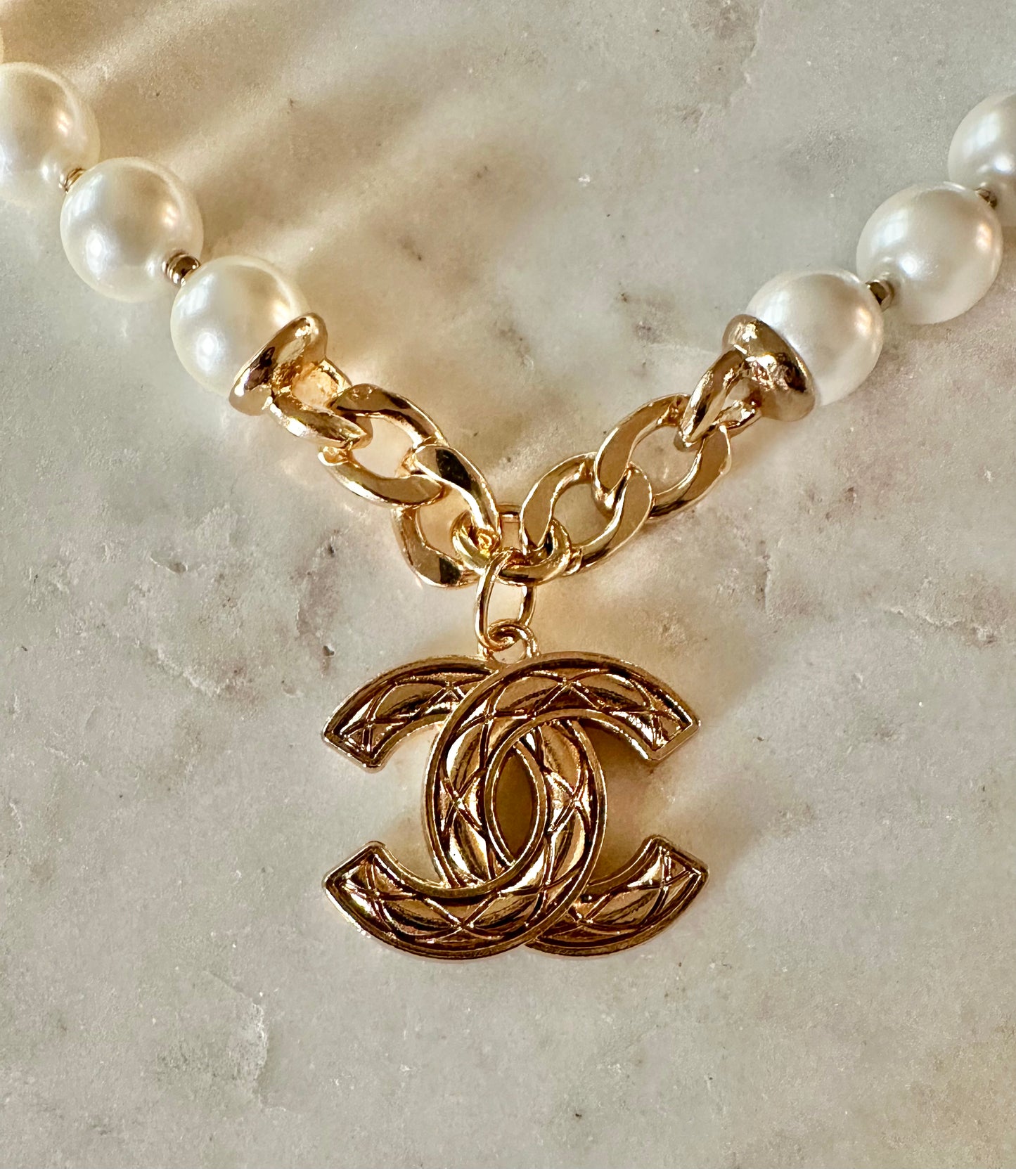 CC quilted and faux pearl necklace