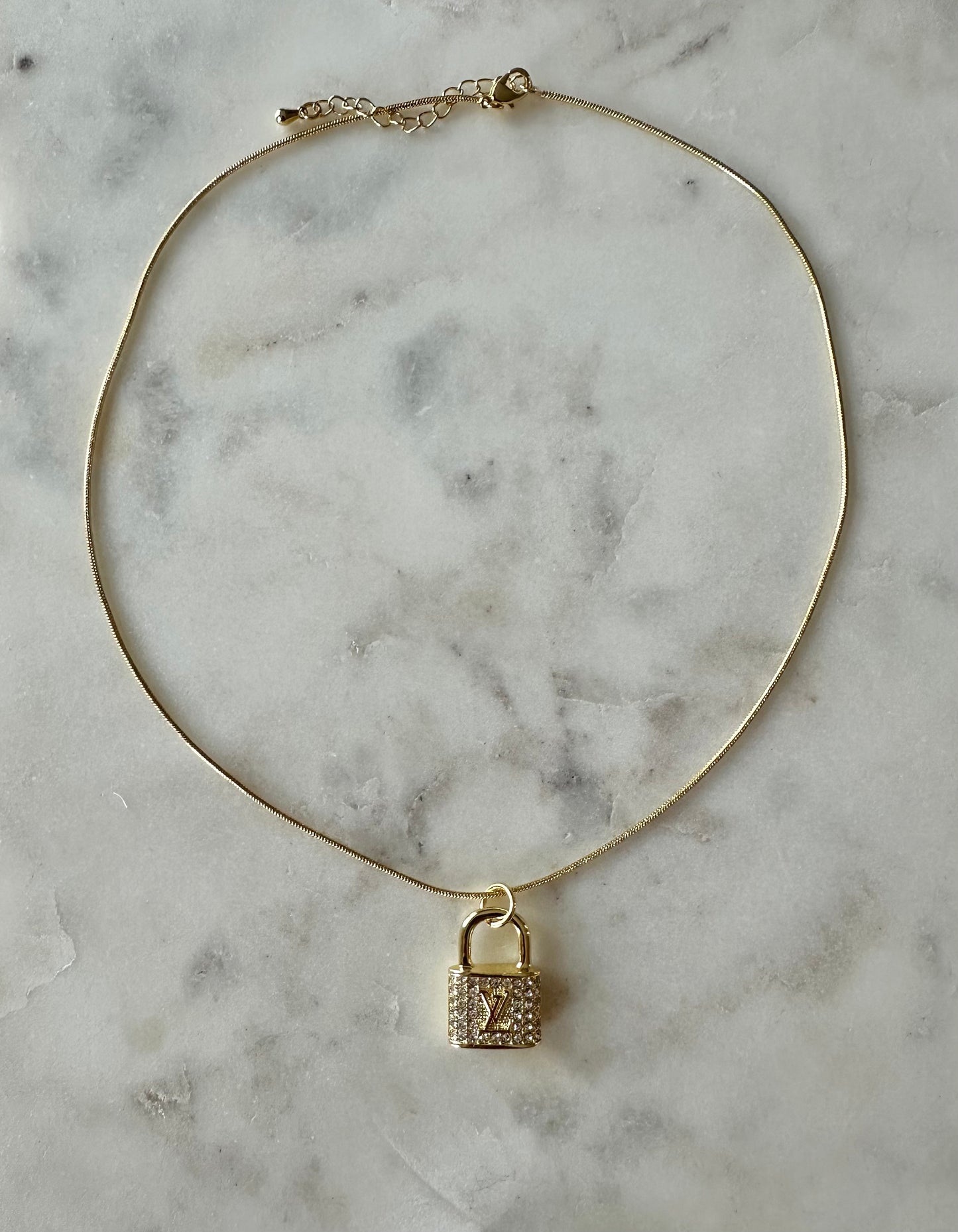 LV gold rhinestone lock necklace 16”