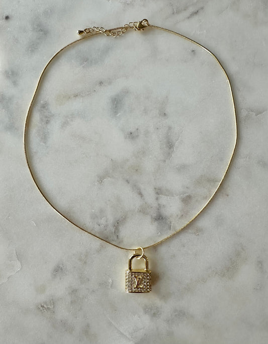LV gold rhinestone lock necklace 16”