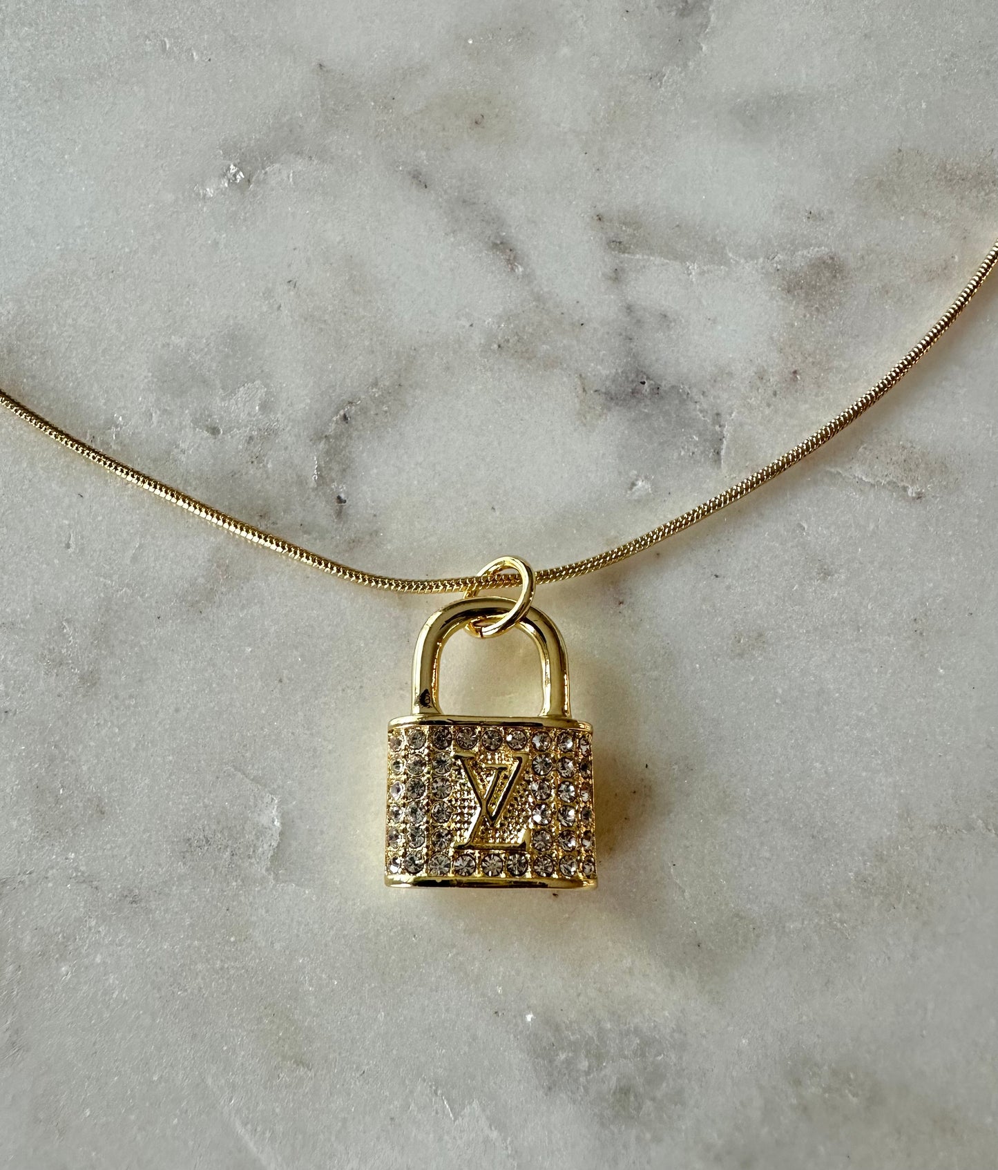 LV gold rhinestone lock necklace 16”