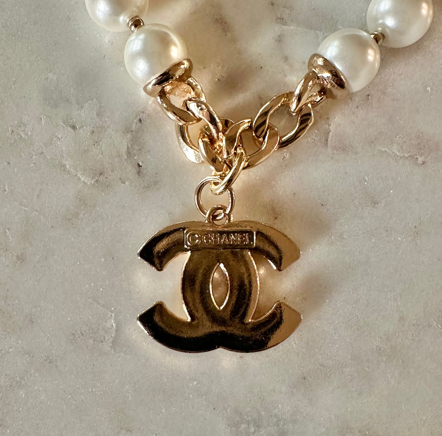 CC quilted and faux pearl necklace