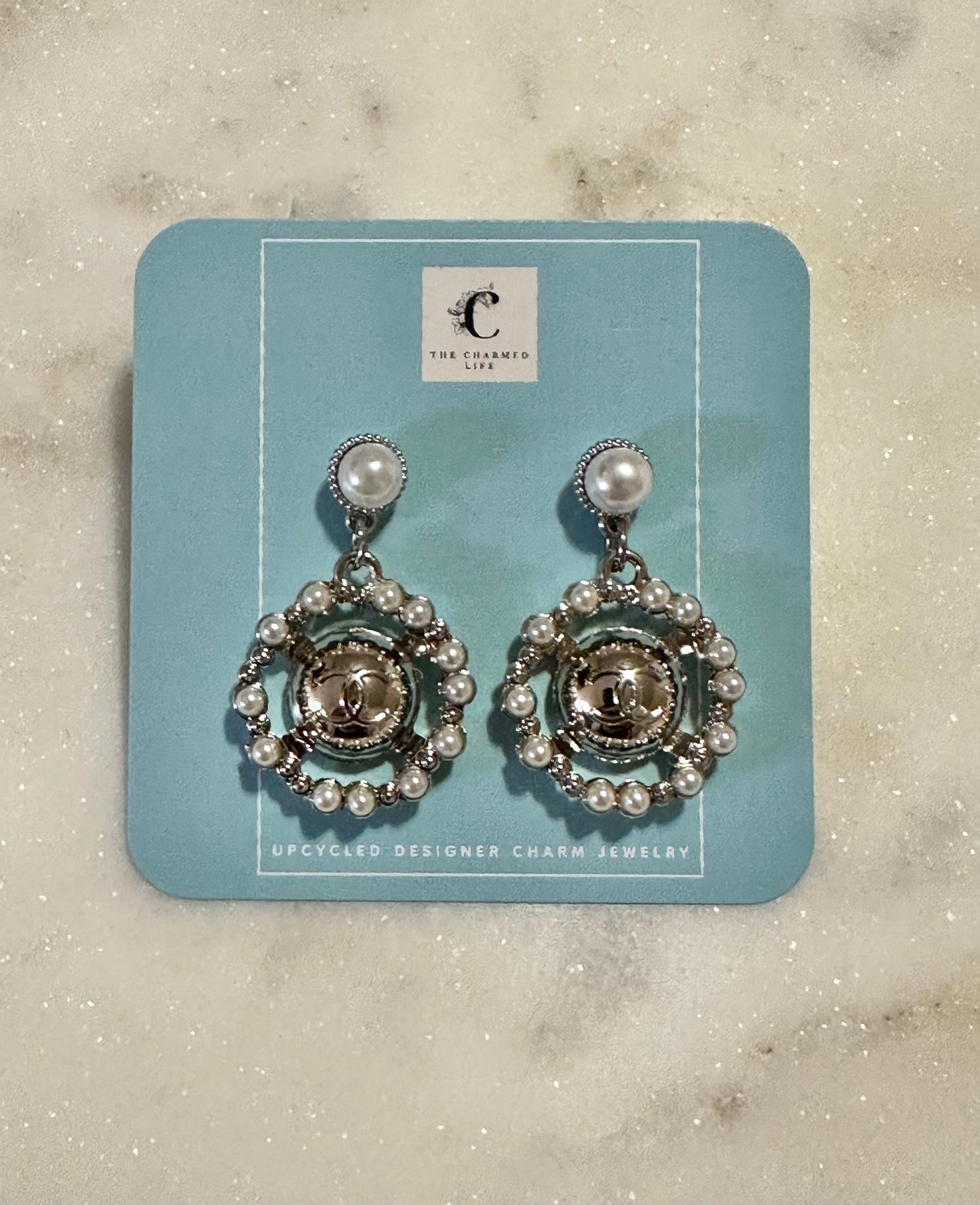 CC pearl and silver tone earrings